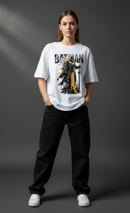 Person wearing a Batman Oversized Graphic Tee white t-shirt with a graphic design on a gray background