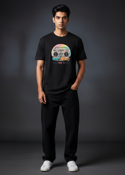 Man wearing a black t-shirt with a colorful graphic design on a dark background
