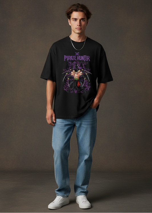 Person wearing a black t-shirt with a graphic design and blue jeans on a plain background