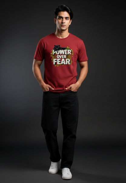 Man wearing a red t-shirt with 'Power Over Fear' text against a dark background