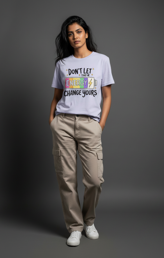 Person wearing a t-shirt with motivational text on a gray background